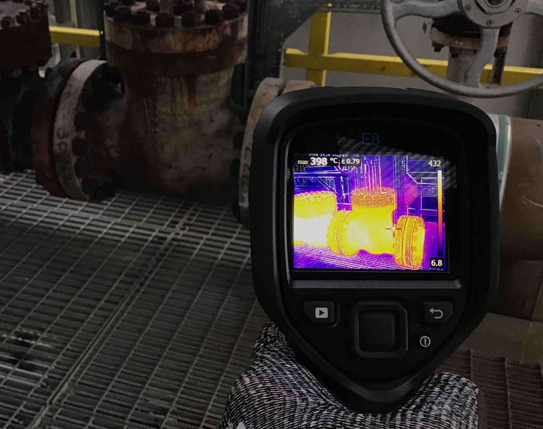 Industrial insulation survey, infrared camera pointing at uninsulated valves